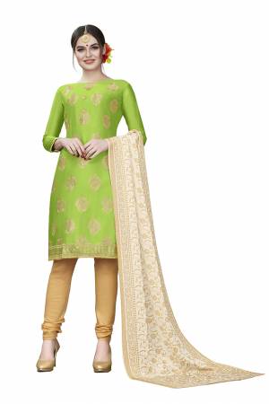 If Those Readymade Suit Does Not Lend You The Desired Comfort Than Grab This Dress Material And Get This Stitched As Per Your Desired Fit And Comfort. Its Top Is In Parrot Green Color Paired With Beige Colored Bottom And Dupatta. Buy This Pretty Elegant Cotton Based Dress Material Now.