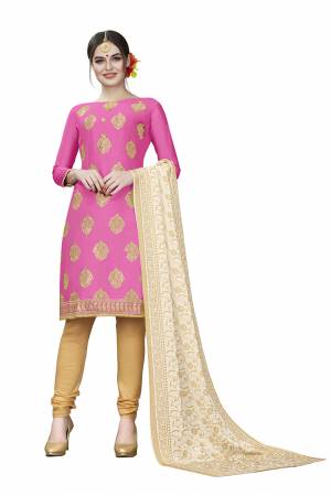 This Festive Season, Adorn A Rich, Simple And Elegant Look With This Dress Material In Fuschia Pink Colored Top Paired With Beige Colored Bottom And Cream Colored Dupatta. This Dress Material Is Cotton Based Beautified With Jari Embroidered Butti. Get This Stitched As Per Your Desired Fit And Comfort. 
