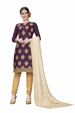 This Festive Season, Adorn A Rich, Simple And Elegant Look With This Dress Material In Dark Wine Colored Top Paired With Beige Colored Bottom And Cream Colored Dupatta. This Dress Material Is Cotton Based Beautified With Jari Embroidered Butti. Get This Stitched As Per Your Desired Fit And Comfort. 