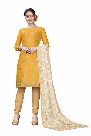 If Those Readymade Suit Does Not Lend You The Desired Comfort Than Grab This Dress Material And Get This Stitched As Per Your Desired Fit And Comfort. Its Top Is In Musturd Yellow Color Paired With Beige Colored Bottom And Dupatta. Buy This Pretty Elegant Cotton Based Dress Material Now.