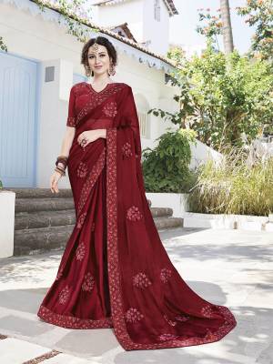 For A Royal Look, Grab This Very Pretty Designer Saree In Maroon Color Paired With Maroon Colored Blouse. This Saree IS Fabricated On Satin Chiffon Paired With Art Silk Fabricated Blouse. Its Pretty Elegant Embroidery Will Earn You Lots Of Compliments From Onlookers. 