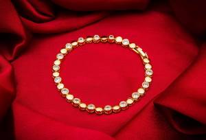 Give An Elegant Look To Your Wrist Wearing This Designer Bracelet?In Golden Color Beautified With Attractive Diamond Work. This Bracelet Can Be Paired With Any Colored And Type Of Attire, Buy Now.