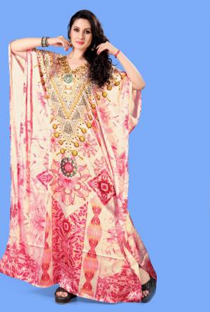 A Must Have Piece To Your Wardrobe Is Here With This Beautiful Readymade Kaftan In Light Pink Color. This Pretty Kaftan Is Fabricated on Satin beautified With Prints And Stone Work. Also It Is In Free Size Which Ensures Superb Comfort. Buy Now