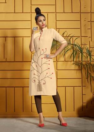 Be It Your College, Home Or Work Place, Grab This Beautiful Designer Readymade Kurti In Elegant Cream Color Fabricated On Rayon. It Is Beautified With Thread Work Which Gives A Subtle Look To It. 
