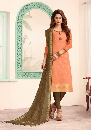 Grab This Very Beautiful Designer Straight Suit In Dark Peach Colored Top Paired With Contrasting Dark Olive Green Colored Bottom And Dupatta. Its Top IS Fabricated On Art Silk Paired With Cotton Bottom And Banarasi Jacquard Dupatta. Buy This Dress Material Now.