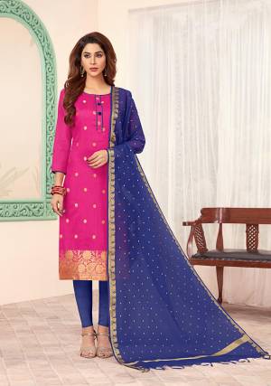 Shine Bright Wearing This Designer Dress Material In Rani Pink Colored Top Paired With Contrasting Royal Blue Colored Bottom And Dupatta. Its Top Is Silk Based Paired With Cotton Bottom And Banarasi Jacquard Dupatta. 