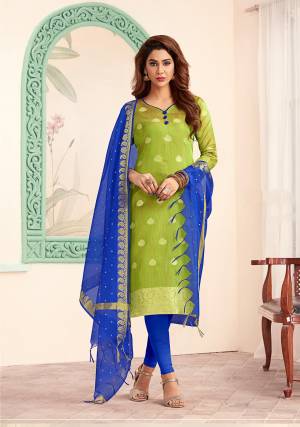 Simple and Elegant Looking Dress Material Is Here For Your Casual Or Semi-Casual wear In Parrot Green Colored Top Paired With Royal Blue Colored Bottom And Dupatta. Get This Silk Based Dress Material Stitched As Per Your Desired Fit And Comfort. 