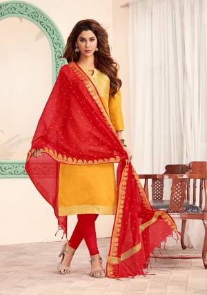 Bright And Visually Appealing Color Pallete Is Here With This Dress Material In Yellow Colored Top paired With Contrasting Red Colored Bottom And Dupatta. Its Top Is Fabricated On Art Silk Paired With Cotton Bottom And Banarasi Jacquard Dupatta. Its Top And Dupatta Are Beautified With Weave. buy This Dress Material now.