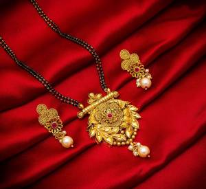 Grab This Heavy Double Chained Magalsutra Set Which Has A Heavy Designer Attatched Pendant With A Pair Of Earrings. This Mangalsutra Can Be Paired With Any Colored Traditional Attire And Suitable For Occasion Wear. Buy Now
