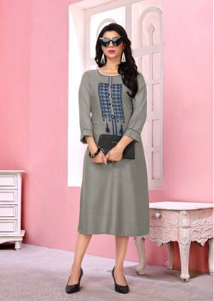 Add This Rich And elegant Looking Readymade Kurti To Your Wardrobe In Grey Color Fabricated On Rayon. This Kurti Is Beautified With Contrasting Colored Thread Embroidery. Buy Now.