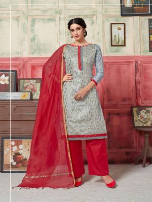 Here Is A Pretty Suit With A Rich Color Pallete In Grey Colored Top Paired With Contrasting Red Colored Bottom and Dupatta. Its Top Is Fabricated On Jacquard Silk Paired With Satoon Bottom And Banarasi Art Silk Dupatta. Buy This Dress Material Now. 