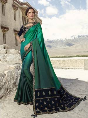 Grab This Very Beautiful Heavy Designer Saree In Sea Green Color Paired With Contrasting Navy Blue Colored Blouse. This Saree Is Fabricated on Soft Silk Paired With Velvet Fabricated Embroidered Blouse. Buy Now.