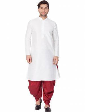 Grab This Royal Set Of Dhoti Kurta For Men's Wear In Maroon And Cream Color. This Readymade Pair Is Fabricated On Cotton Silk Which Gives A Rich Look To Your Personality. Also Its Is Available In All Sizes, Choose As Per Your Desired Fit And Comfort. Its Fabric Is Rich In Class And Durable. Buy Now.