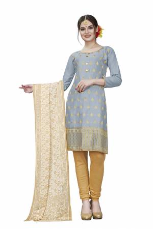 If Those Readymade Suit Does Not Lend You The Desired Comfort Than Grab This Dress Material And Get This Stitched As Per Your Desired Fit And Comfort. Its Top Is In Light Grey Color Paired With Beige Colored Bottom And Dupatta. Buy This Pretty Elegant Cotton Based Dress Material Now.