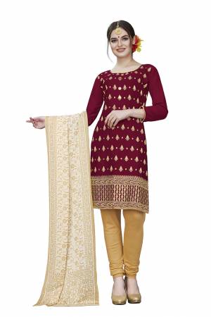 If Those Readymade Suit Does Not Lend You The Desired Comfort Than Grab This Dress Material And Get This Stitched As Per Your Desired Fit And Comfort. Its Top Is In Maroon Color Paired With Beige Colored Bottom And Dupatta. Buy This Pretty Elegant Cotton Based Dress Material Now.