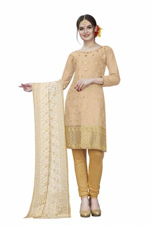 This Festive Season, Adorn A Rich, Simple And Elegant Look With This Dress Material In Cream Colored Top Paired With Beige Colored Bottom And Cream Colored Dupatta. This Dress Material Is Cotton Based Beautified With Jari Embroidered Butti. Get This Stitched As Per Your Desired Fit And Comfort. 