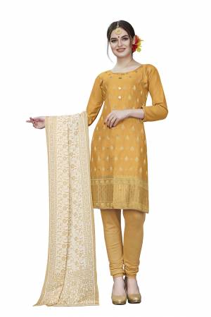 If Those Readymade Suit Does Not Lend You The Desired Comfort Than Grab This Dress Material And Get This Stitched As Per Your Desired Fit And Comfort. Its Top Is In Musturd Yellow Color Paired With Beige Colored Bottom And Dupatta. Buy This Pretty Elegant Cotton Based Dress Material Now.