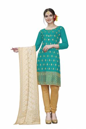 If Those Readymade Suit Does Not Lend You The Desired Comfort Than Grab This Dress Material And Get This Stitched As Per Your Desired Fit And Comfort. Its Top Is In Sea Blue Color Paired With Beige Colored Bottom And Dupatta. Buy This Pretty Elegant Cotton Based Dress Material Now.