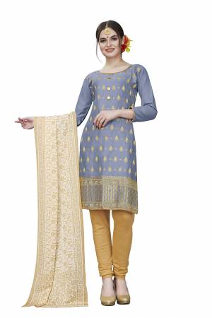 If Those Readymade Suit Does Not Lend You The Desired Comfort Than Grab This Dress Material And Get This Stitched As Per Your Desired Fit And Comfort. Its Top Is In Grey Color Paired With Beige Colored Bottom And Dupatta. Buy This Pretty Elegant Cotton Based Dress Material Now.