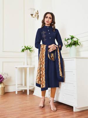 Enhance Your Personality In This Readymade Pretty Kurti In Navy Blue Color Paired With Musturd And Cream Colored Dupatta. Its Top Is Rayon Based Paired With Soft Silk Fabricated Dupatta. It Is Light Weight And Its Fabric Ensures Superb Comfort All Day Long. 