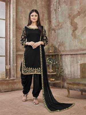 Get Ready For The Upcoming Festive And Wedding Season With This Designer Suit In Black Color Paired With Black Colored Bottom And Dupatta. Its Top Is Fabricated On Art Silk Paired With Santoon Bottom And Net Fabricated Dupatta. It Is Beautified With Heavy Jari Embroidery And Mirror Work. Buy Now.