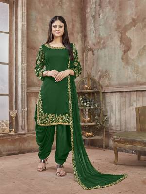 Get Ready For The Upcoming Festive And Wedding Season With This Designer Suit In Green Color Paired With Green Colored Bottom And Dupatta. Its Top Is Fabricated On Art Silk Paired With Santoon Bottom And Net Fabricated Dupatta. It Is Beautified With Heavy Jari Embroidery And Mirror Work. Buy Now.