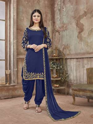 Get Ready For The Upcoming Festive And Wedding Season With This Designer Suit In Royal Blue Color Paired With Royal Blue Colored Bottom And Dupatta. Its Top Is Fabricated On Art Silk Paired With Santoon Bottom And Net Fabricated Dupatta. It Is Beautified With Heavy Jari Embroidery And Mirror Work. Buy Now.