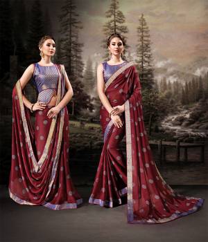 For A Royal And Beautiful Look, Grab This Designer Saree In Maroon Color Paired With Contrasting Purple Colored Blouse. This Saree Is Fabricated On Chiffon Paired With Art Silk Fabricated Blouse. Its Pretty Color Pallete And Fabric Will Earn You Lots Of Compliments From onlookers. 