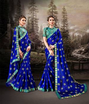Shine Bright In This Very Pretty Designer Saree In Royal Blue Color Paired With Contrasting Sea Green Colored Blouse. This Saree Is Fabricated On Chiffon Beautified With Prints Paired With Art Silk Fabricated Weaved Blouse. Buy This Saree Now.