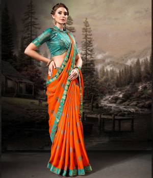 For A Royal And Beautiful Look, Grab This Designer Saree In Orange Color Paired With Contrasting Turquoise Blue Colored Blouse. This Saree Is Fabricated On Chiffon Paired With Art Silk Fabricated Blouse. Its Pretty Color Pallete And Fabric Will Earn You Lots Of Compliments From onlookers. 