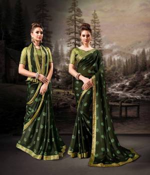 Bright And Appealing Color Is Here With This Saree In Dark Green Color Paired With Green Colored Blouse. This Saree Is Chiffon Based Paired With Art Silk Fabricated Blouse. It Is Light In Weight And Easy To Carry All Day Long. 