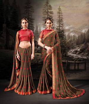 Shine Bright In This Very Pretty Designer Saree In Brown Color Paired With Contrasting Red Colored Blouse. This Saree Is Fabricated On Chiffon Beautified With Prints Paired With Art Silk Fabricated Weaved Blouse. Buy This Saree Now.