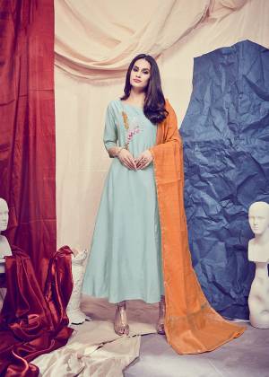 Rich And Elegant Looking Designer Readymade Kurti Is Here In Aqua Blue Color Paired With Contrasting Orange Colored Dupatta. Its Top Is Fabricated On Soft Silk Beautified With Hand Paired With Banarasi Art Silk Dupatta. This Lovely Pair IS Also Light In Weight And Easy To Carry All Day Long. 