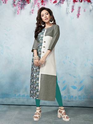 Be It Your College, Home Or Work Place, This Readymade Kurti In Grey And White Color IS Suitable For All. It Is Fabricated On Linen Cotton Beautified With Prints. Buy Now.