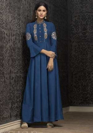 Grab This Very Beautiful Designer Readymade Gown In Blue Color Fabricated On Muslin. This Pretty Gown Is Beautified with Attractive And Elegant Looking Minimal Embroidery Which Earn You Lots Of Compliments From Onlookers. 