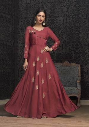 Celebrate This Festive Season With Beauty And Comfort Wearing This Designer Piece In Dark Pink Colored Readymade Gown. This Pretty Gown Is Muslin Based Beautified With Attractive Embroidery. Buy Now.