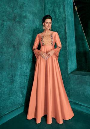 Grab This Very Beautiful Designer Readymade Gown In Dark Peach Color Fabricated On Soft Art Silk Beautified With Attractive Embroidery Over Yoke And Sleeves. Its Pretty Color And Embroidery Will Give An Attractive Look To your Personality. 