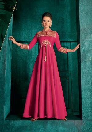 Bright And Visually Appealing Color Is Here With This Very Beautiful Designer Readymade Gown In Dark Pink Color Fabricated Soft Art Silk. It Is Beautified With Minimal Elegant Looking Embroidery Which Will Earn You Lots Of Compliments From Onlookers. 