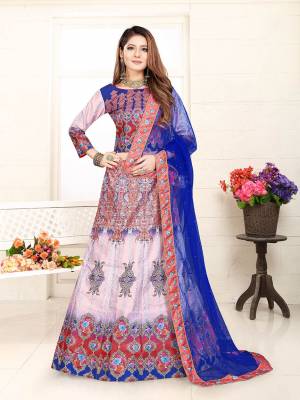 Here Is A Very Pretty Designer Lehenga Choli In Dusty Pink And Royal Blue Color. This Pretty Lehenga Choli IS Silk Based Beautified With Digital Prints And Stone Work, Its Rich Fabric, Color and Print Will Definitely Earn You Lots Of Compliments From Onlookers. 