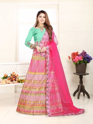 Go Colorful With This Very Pretty Designer Lehenga Choli In Light Green And Dark Pink Color Fabricated On Art Silk. Its Dupatta IS Fabricated On Net Beautified Stone Work And Lace Border. Buy This Lehenga Choli Now.