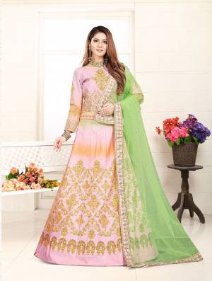 Look Pretty In This Lovely Color Pallete With This Designer Lehenga Choli In Dusty Pink Color Paired With Contrasting Light Green Colored Dupatta. It Is Fabricated On Art Silk Paired With Net Fabricated Dupatta. Buy Now.