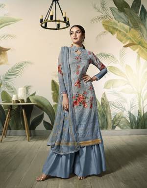 Here Is A Trendy And Very Pretty Designer Lakhnavi Suit In Steel Blue Color Which Is Beautified With Heavy Thread And Jari Work Also With Digital Prints. Its Top IS Geirgette Based Paired With Santoon Bottom And Chiffon Fabricated Dupatta. 