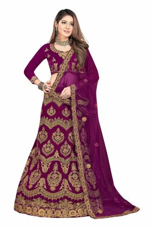 Set A New Trend For Bridal Wear By Wearing This Heavy Designer Lehenga Choli In Wine Color. This Pretty Heavy Embroidered Lehenga Choli Is Fabricated On Velvet Paired With Net Fabricated Dupatta. Its Fabric Is Soft Towards Skin And Ensures Superb Comfort Throughout The Gala.