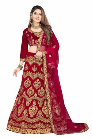 Here Is A Very Beautiful And Heavy Designer Lehenga Choli For Bridal Wear In All Over Maroon Color. Its Blouse And Lehenga Are Velvet Based Paired With Net Fabricated Dupatta. Its Heavy Embroidery And Rich Fabric Will Earn You Lots Of Compliments From Onlookers. 