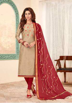 Here Is A Royal Looking Designer Suit With Rich Color Pallet In Beige Colored Top Paired With Contrasting Maroon Colored Bottom And Dupatta. Its Top Is Fabricated On Cotton Slub Paired with Cotton Bottom And Chanderi Cotton Fabricated Dupatta. Its Top And Dupatta are Beautified With Thread Work.