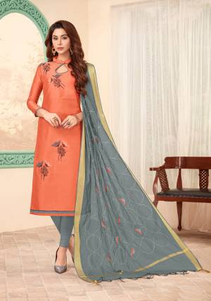 Lovely Color Combination Is Here With This Designer Dress Material In Light Orange Color Paired With Contrasting Grey Colored Bottom And Dupatta. This Dress Material Is Cotton Based Beautified With Attractive Thread Work And Pearl. 