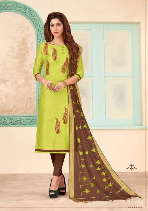Lovely Color Combination Is Here With This Designer Dress Material In Light Green Color Paired With Contrasting Brown Colored Bottom And Dupatta. This Dress Material Is Cotton Based Beautified With Attractive Thread Work And Pearl. 