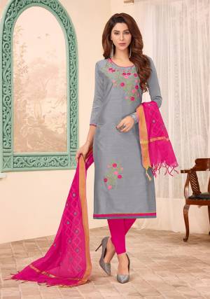 Lovely Color Combination Is Here With This Designer Dress Material In Grey Color Paired With Contrasting Rani Pink Colored Bottom And Dupatta. This Dress Material Is Cotton Based Beautified With Attractive Thread Work And Pearl. 