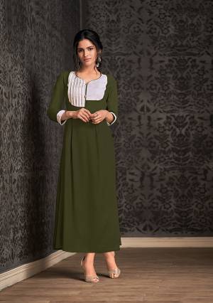 Add This Pretty Readymade Long Kurti To Your Wardrobe In Olive Green For Your Semi-Casuals. This Kurti IS Fabricated On Rayon Beautified With Pattern Over Neck And Sleeves.