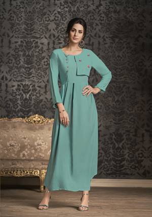 Simple And Elegant Looking Readymade Long Kurti Is Here For Your Semi-Casual Wear Is Here In Lovely Turquoise Blue Color. This Kurti IS Fabricated On Rayon Which Is Soft Towards Skin And Available In All Sizes. 